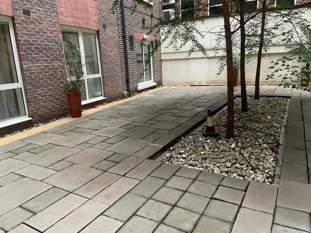 Spotless outdoor courtyard paving after pressure washing