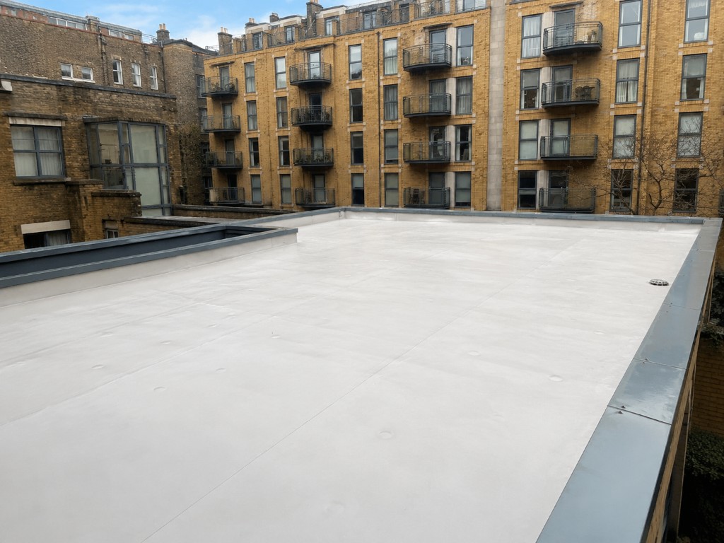 Pristine commercial flat roof after professional cleaning